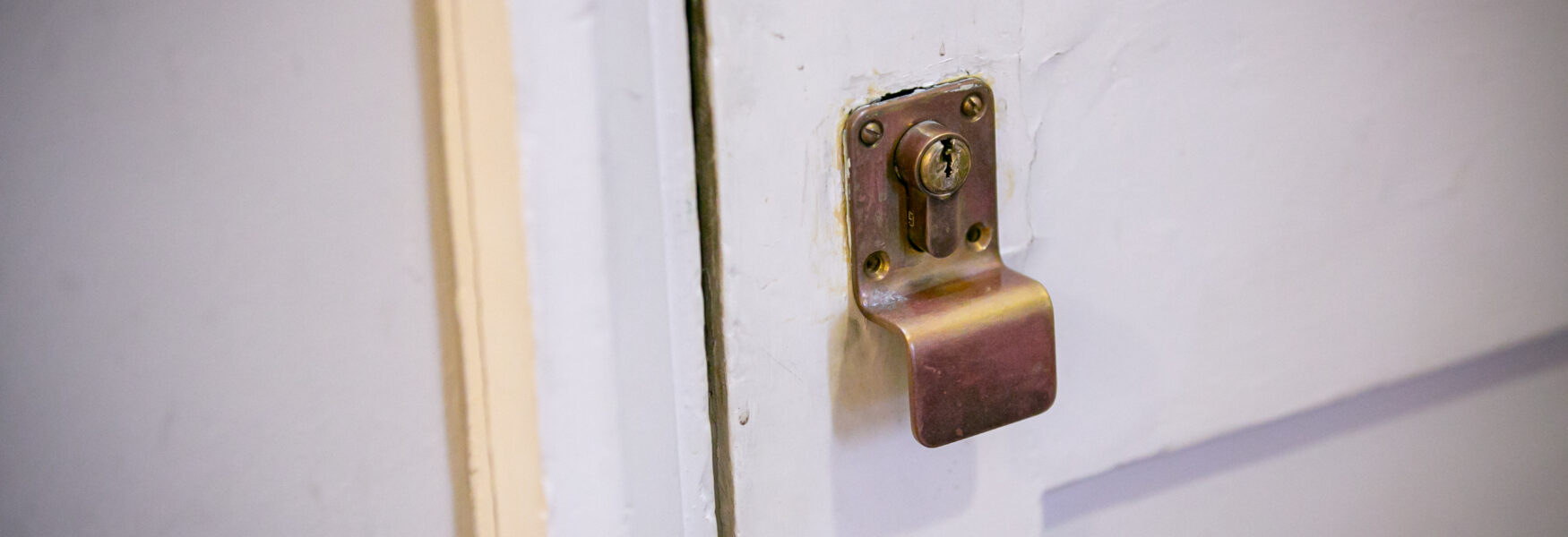 White door with gold lock.